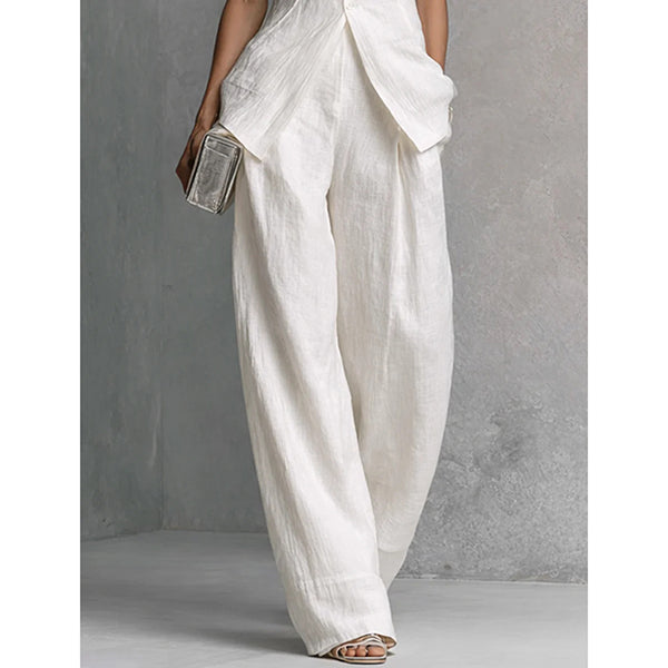 Zetian | Elegant two-piece women's outfit with a sleeveless peplum top, stand-up collar and wide-legged trousers
